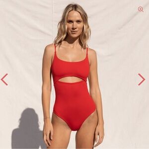 Left on Friday Peak one piece in Sweet Chili Heat (bright red) in size L.